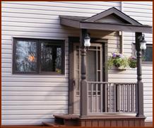 Detail: Porch roof with dormer & coach lights. (Can be enclosed)
