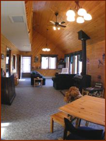 Expansive 36-foot "Great Room" with 16-foot vaulted pine ceiling, copious windows overlooking the lake.