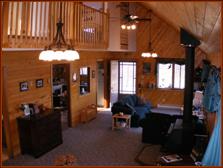 2-story Great Room with vaulted ceilings sweeping up to the loft/balcony above