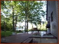450-square-foot deck overlooking the lake, (Lake visible in the background).